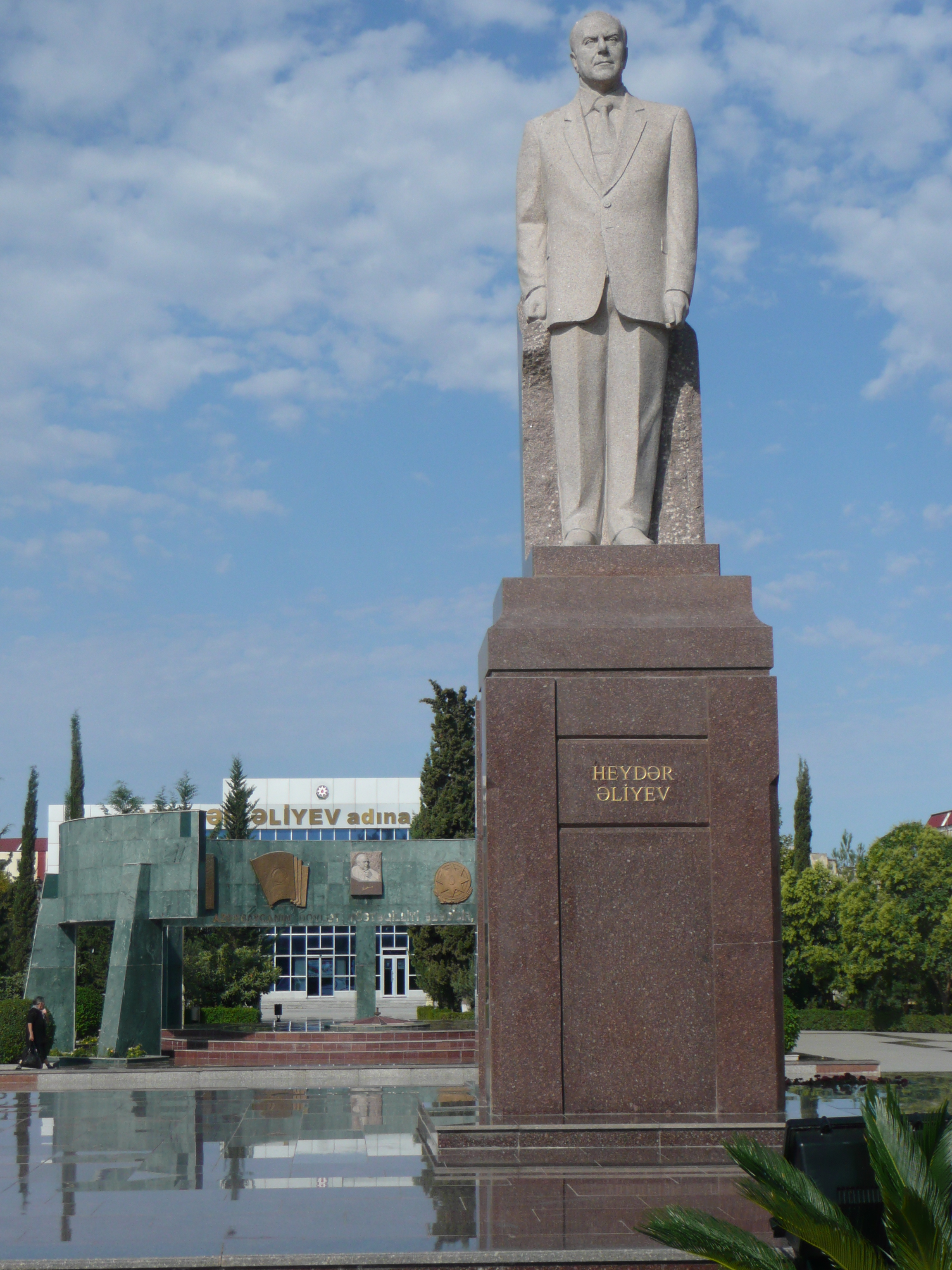 Heydar Aliyev statue in Heydar Aliyev park on Heydar Aliyev St with Heydar Aliyev building behind (yes really)