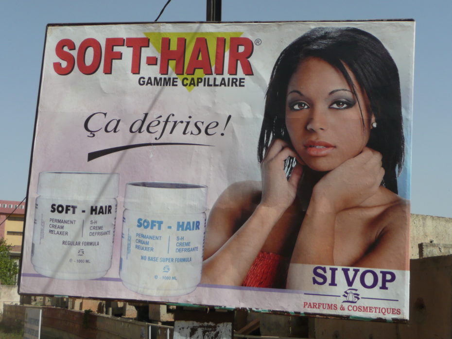 An ad for hair straightener with a model who probably had straight hair to start with. Also some English words to add a bit of exotic "cool" in French speaking Burkina Faso