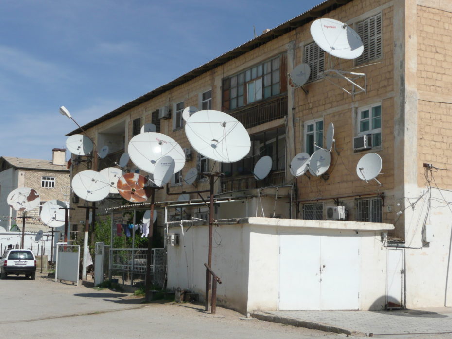 The profusion of satelite dishes on buildings hardly reflects the access to independent media, it's not as if they have to worry about the Russian news giving them ideas of democracy