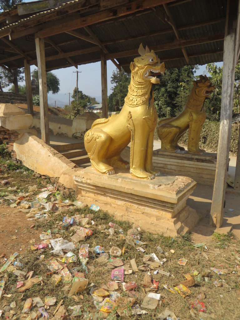 Offerings of holy garbage at a temple entrance