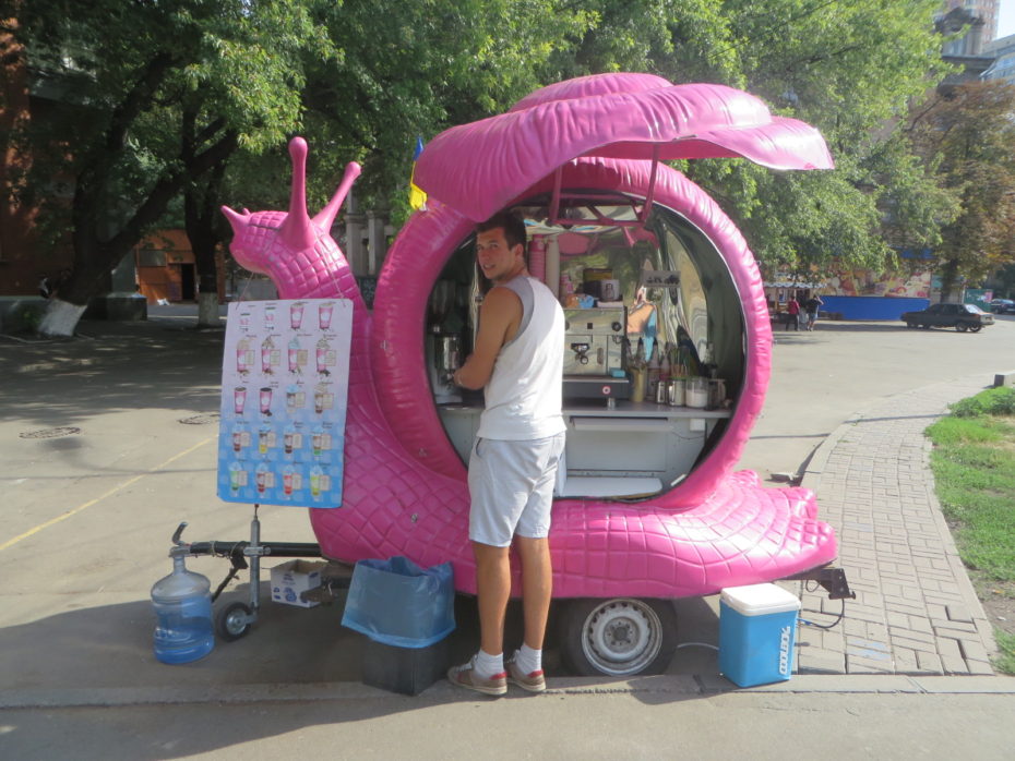 If ever an image captured the contradictions of Kiev its that of a snail, the epitomy of slowness, being used to sell a product designed to make you speed up