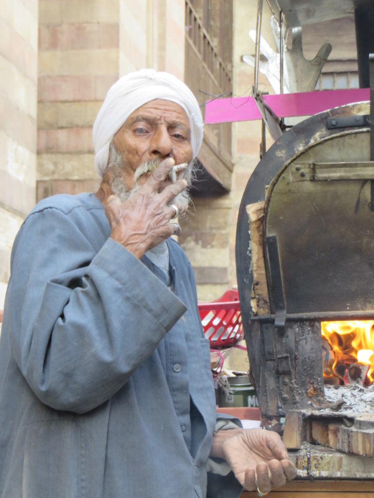 A baked potato seller on a quick ciggie break