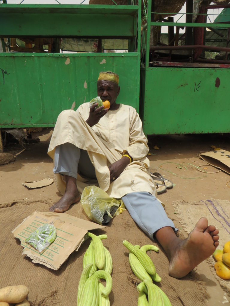 Sudanese market seller clearly unconcerned by the evils of colonialism